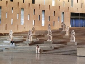 10 identical, seated limestone statues of Pharaoh Senusret I